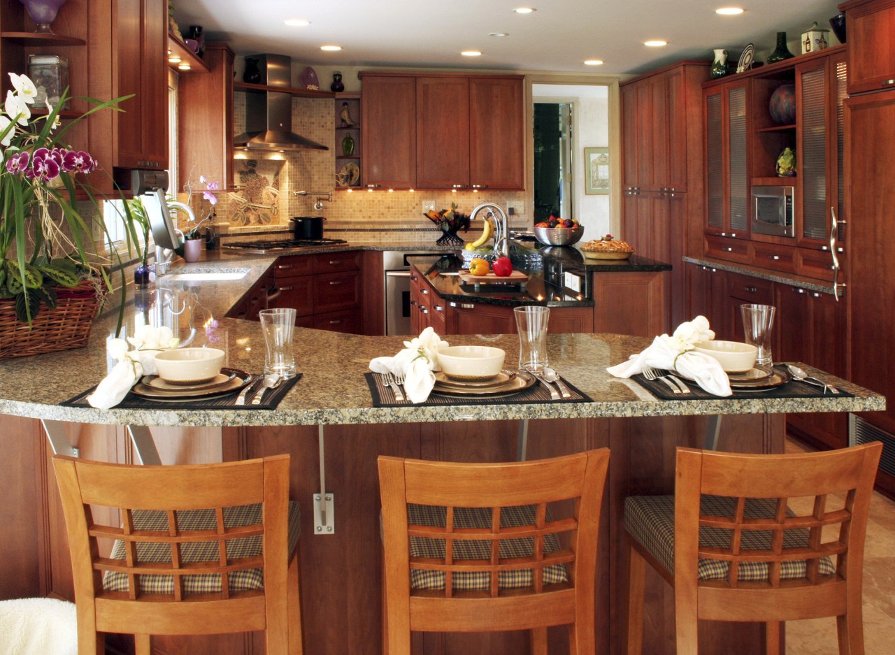 view of kitchen by Dream Kitchens, featuring cabinetry, countertop, interior design, kitchen, restaurant, room, red