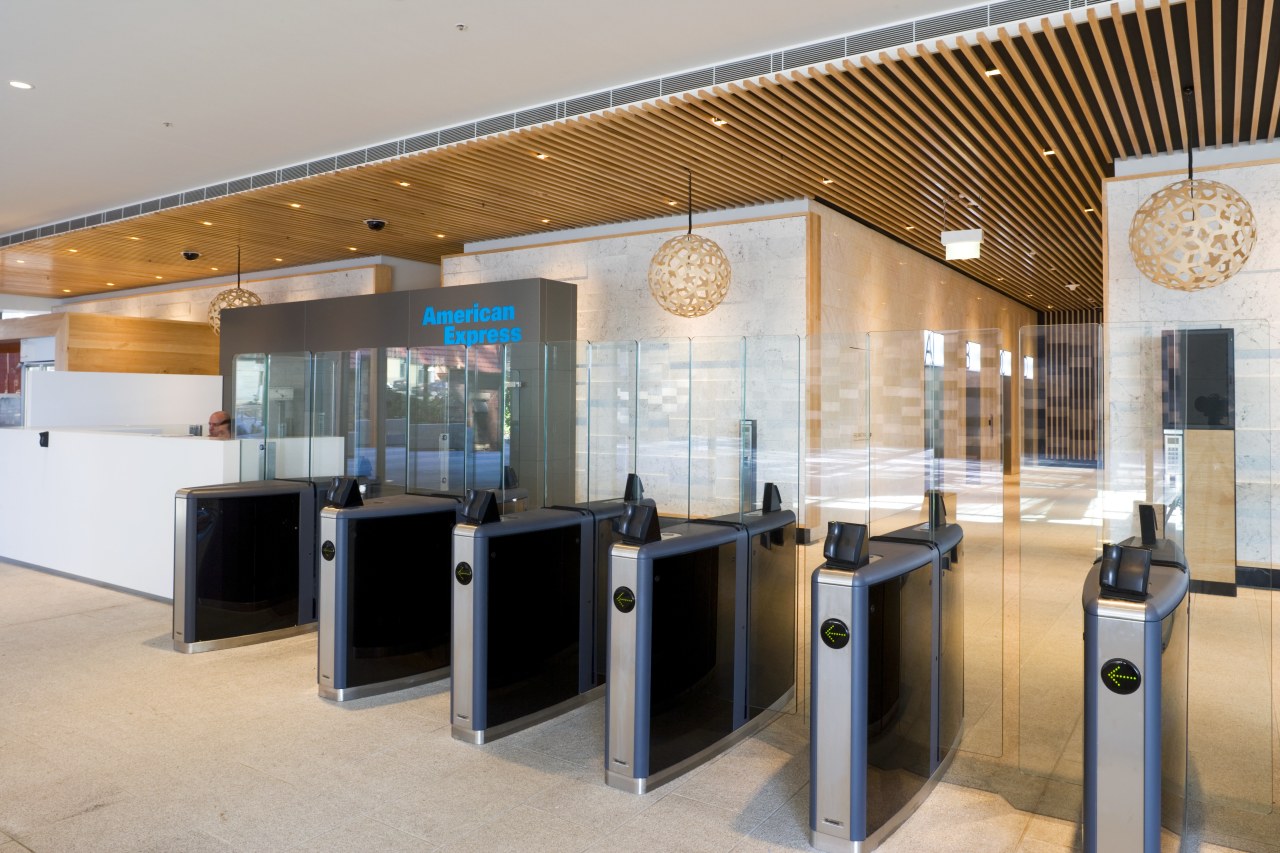 Security is tight, yet toughened-glass barriers lessen the interior design, lobby, gray