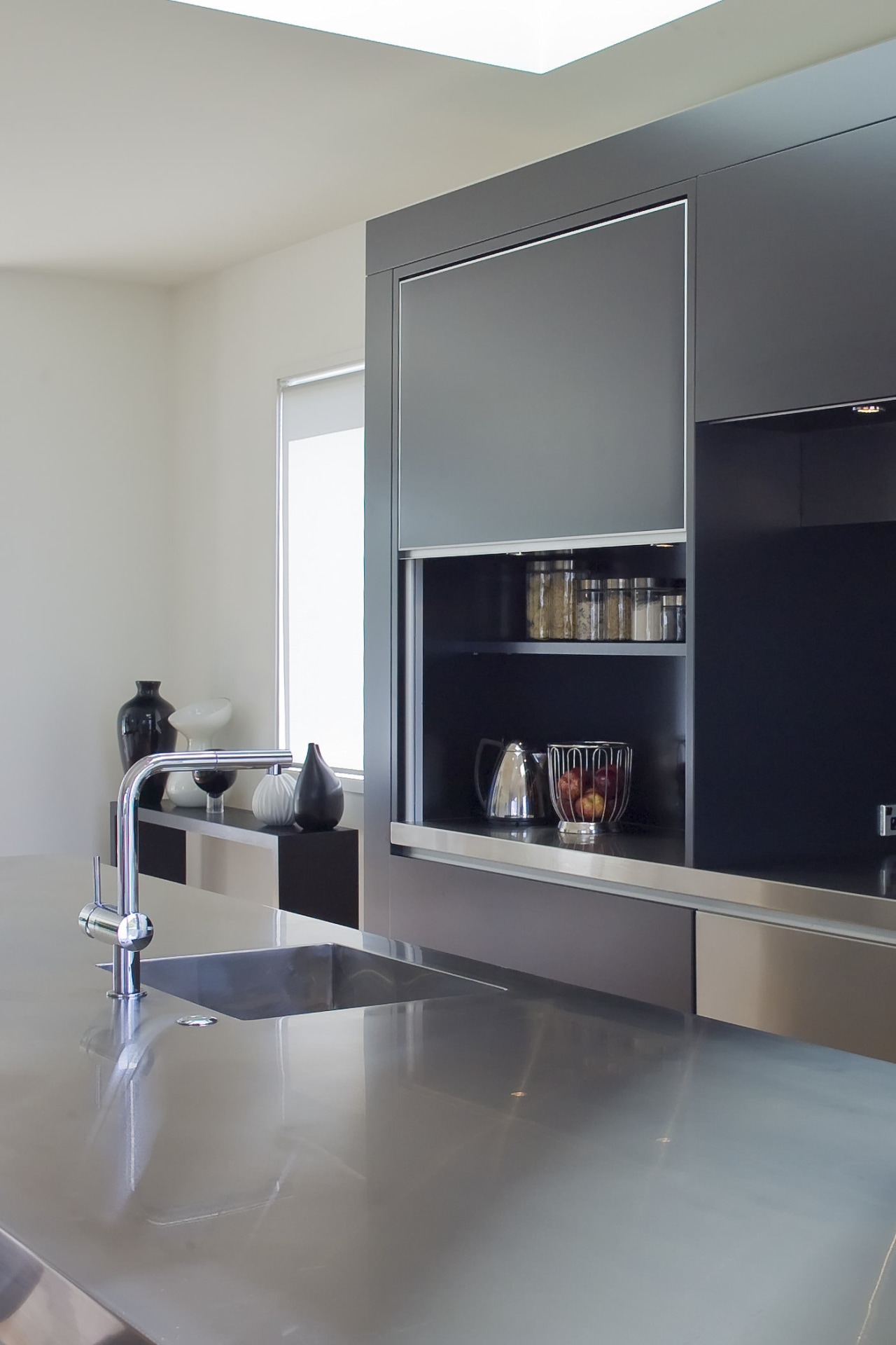 Designer Robyn Labb used a simple material palette countertop, floor, furniture, interior design, kitchen, product design, shelf, shelving, gray