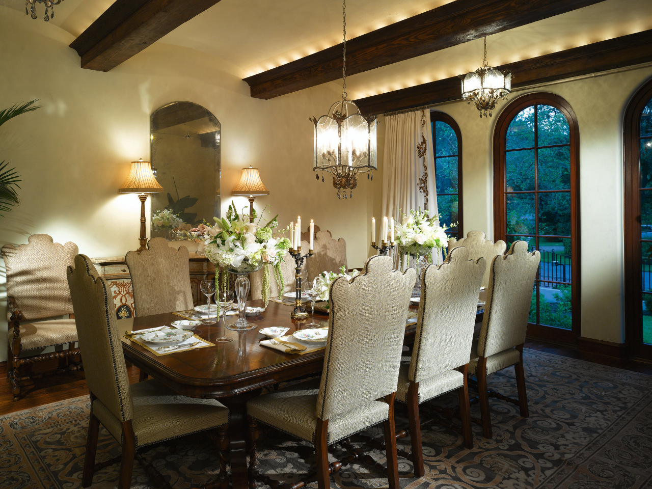 View of the dining room which features chandeliers, ceiling, dining room, function hall, home, interior design, restaurant, room, table, brown