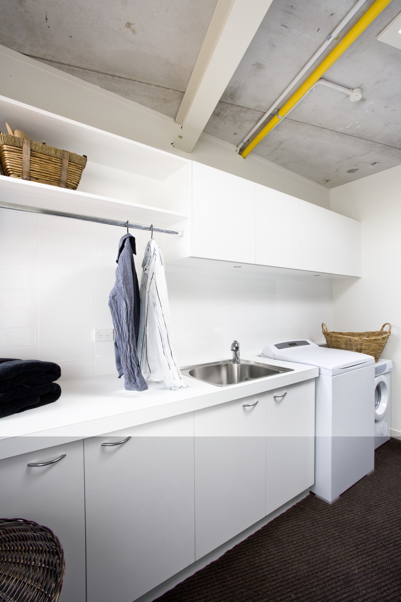 View of a laundry which was added to countertop, floor, furniture, interior design, kitchen, laundry room, product design, room, white, gray