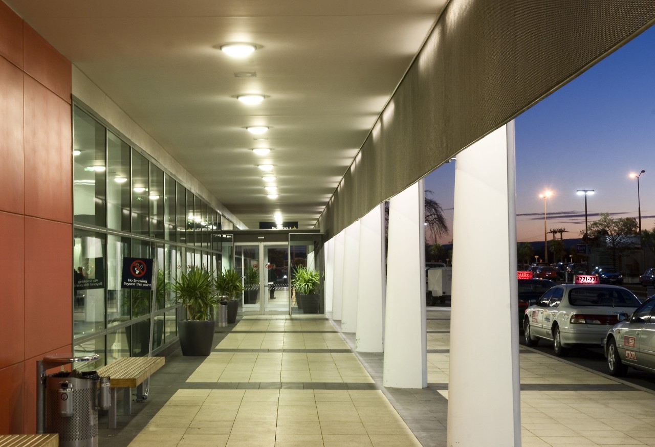 A PW400 four-sided mechanically entrapped curtainwall system is architecture, ceiling, daylighting, lobby, metropolitan area, real estate, brown