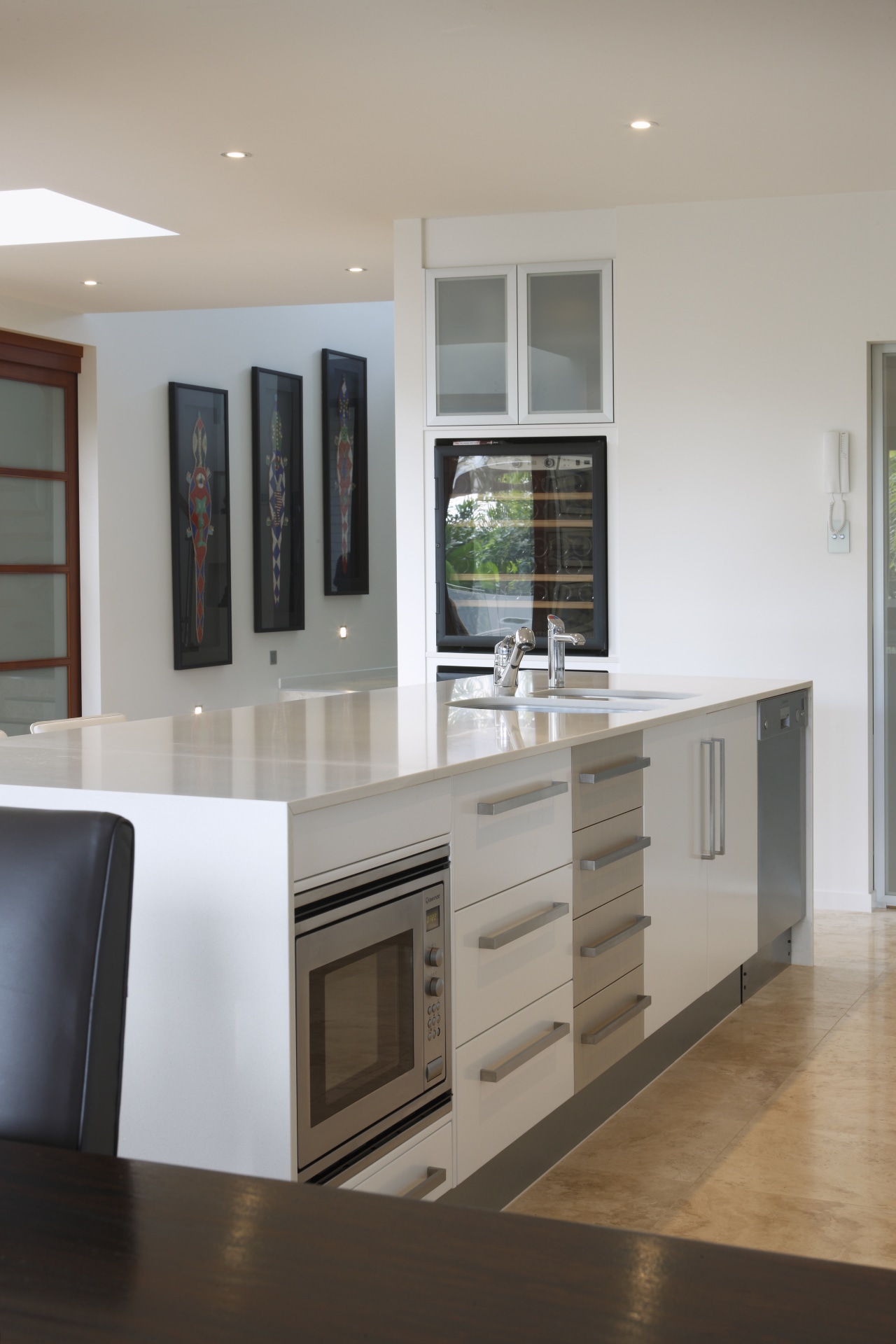 Kleenmaid's spacious microwave and energy-efficient dishwasher are intergrated cabinetry, countertop, floor, furniture, hardwood, home appliance, interior design, kitchen, room, shelving, gray