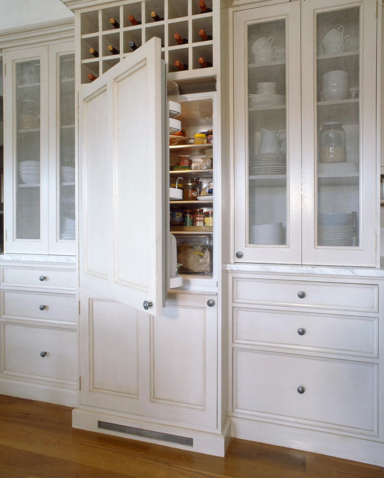 Precision carpentry makes this fridge seem to disappear bathroom accessory, bookcase, cabinetry, chest of drawers, china cabinet, closet, cupboard, display case, drawer, furniture, hardwood, shelf, shelving, wardrobe, wood stain, gray, white