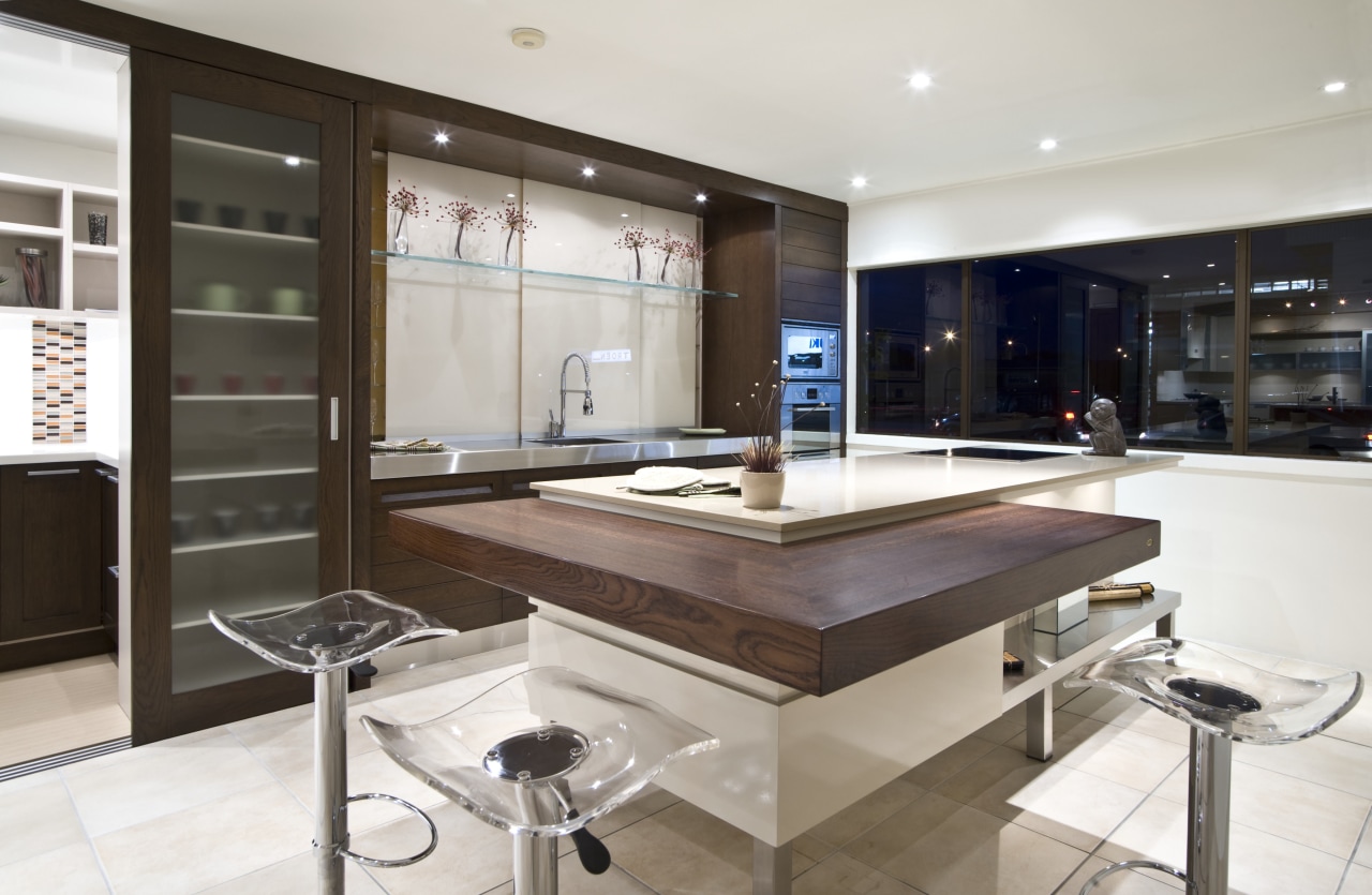 A dsitinctive, mixed material palette features in this cabinetry, countertop, cuisine classique, interior design, kitchen, white