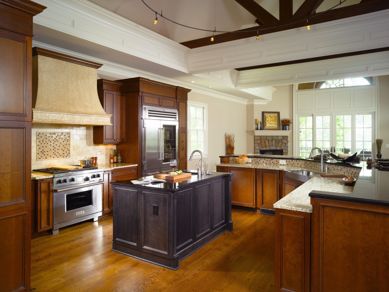 Different wood and granite types visually draw the cabinetry, ceiling, countertop, cuisine classique, estate, flooring, hardwood, interior design, kitchen, real estate, room, brown, gray