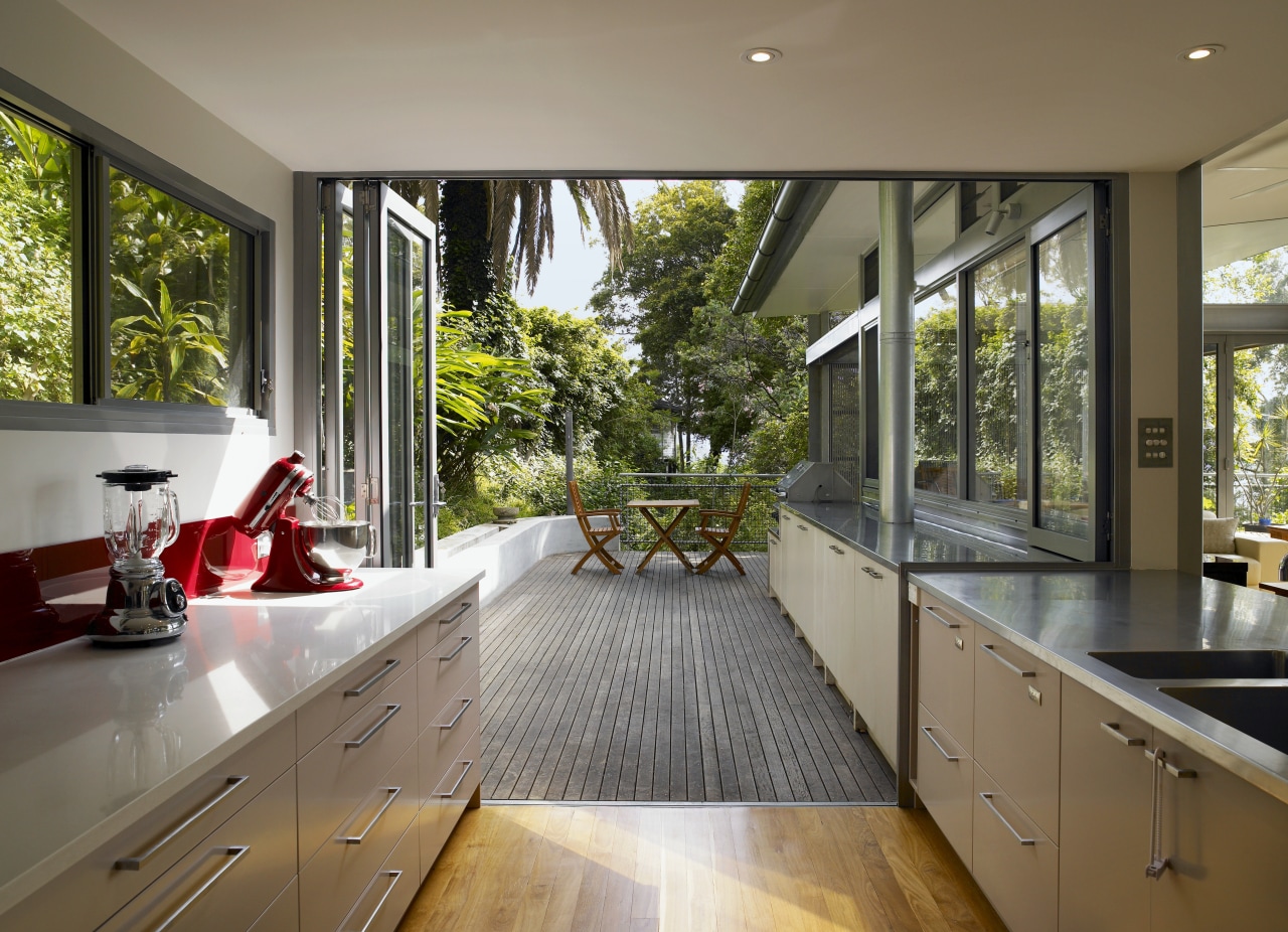 The indoor-outdoor flow is accentuated by the natural architecture, countertop, daylighting, estate, home, house, interior design, property, real estate, window, brown, gray