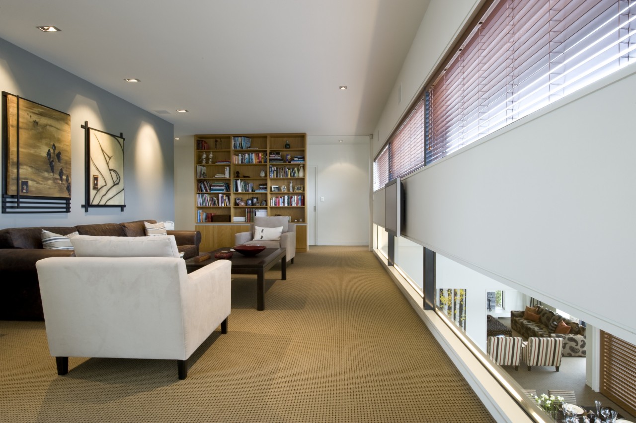 A niche window looks down from the libary architecture, ceiling, interior design, living room, lobby, real estate, room, gray, brown