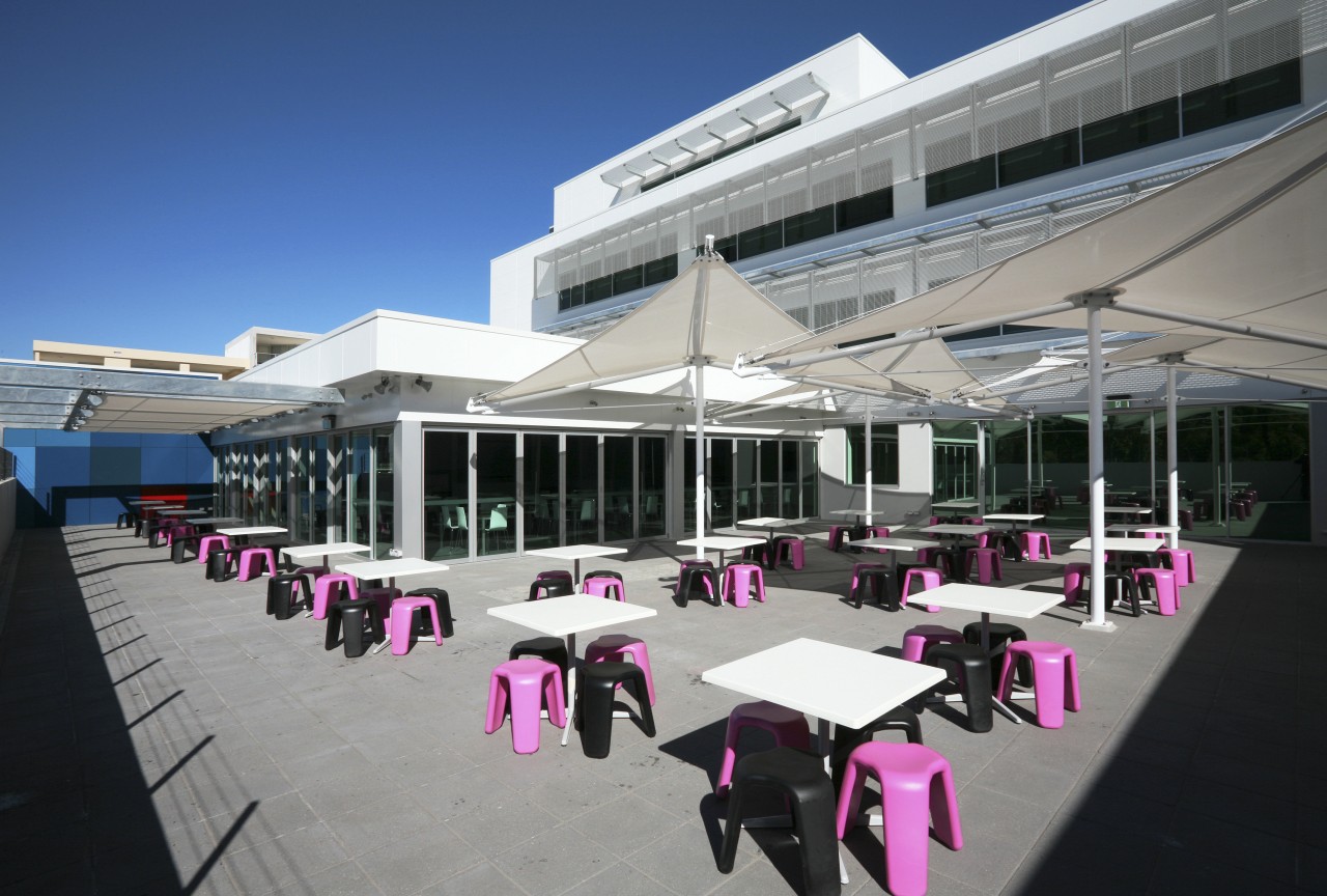 View the cafeteria area which features a crescent-shaped structure, gray