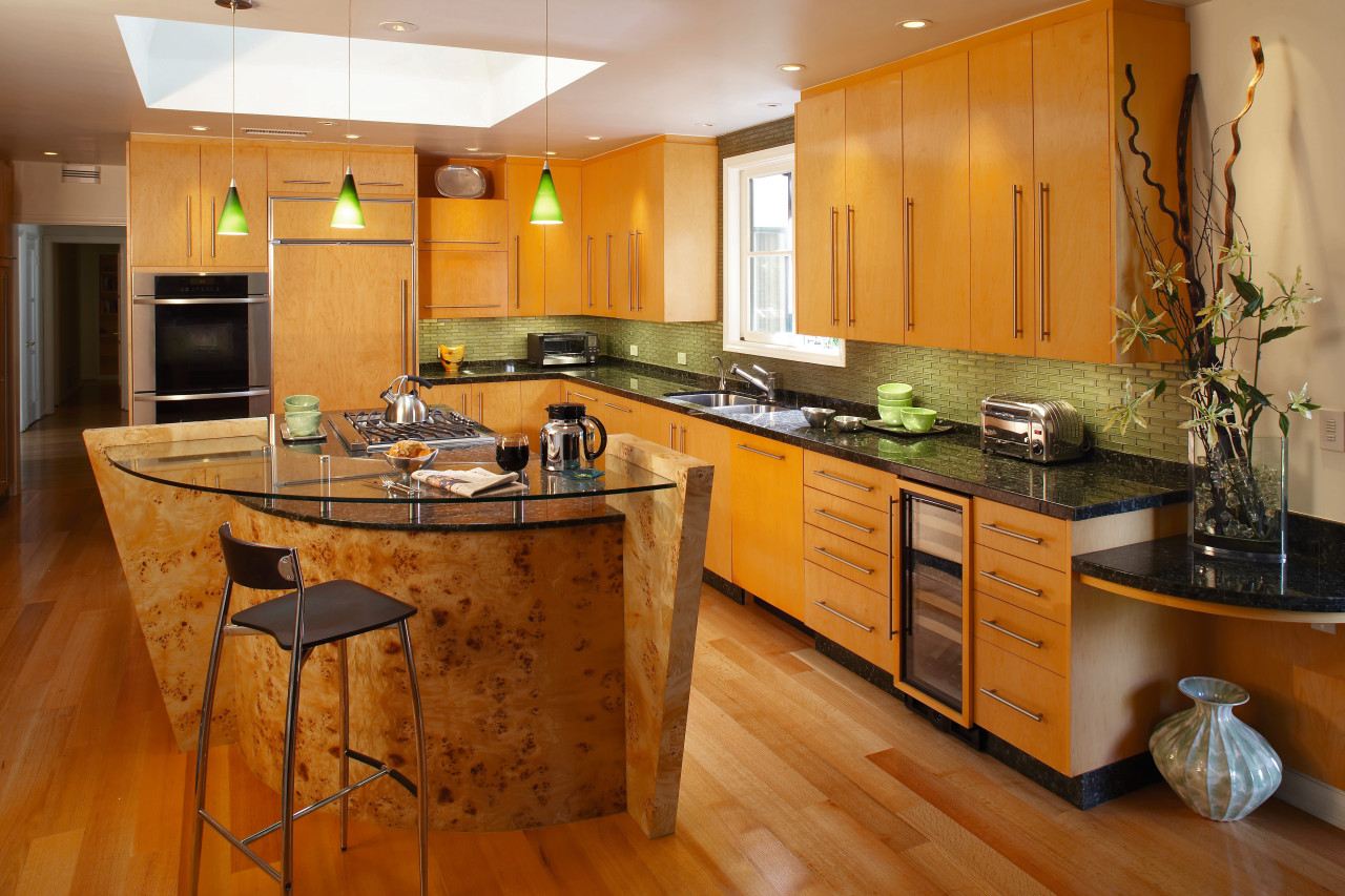 The focal point of this kitchen is the cabinetry, countertop, cuisine classique, floor, flooring, hardwood, interior design, kitchen, real estate, room, wood flooring, brown, orange