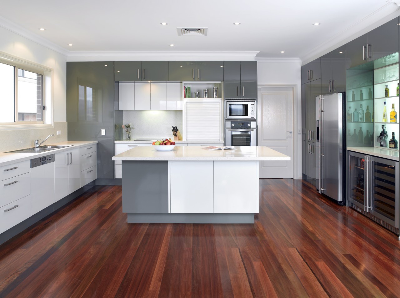 This kitchen, fitted out with the latest Kleenmaid cabinetry, countertop, cuisine classique, floor, flooring, hardwood, interior design, kitchen, laminate flooring, real estate, room, wood, wood flooring, white, red