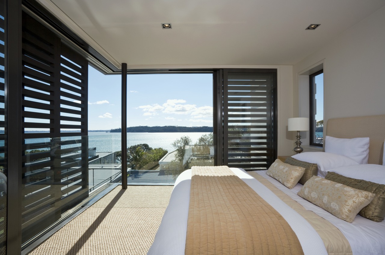 View of the master bedroom suite which features bedroom, condominium, daylighting, door, estate, house, interior design, penthouse apartment, property, real estate, room, window, window covering, wood, gray