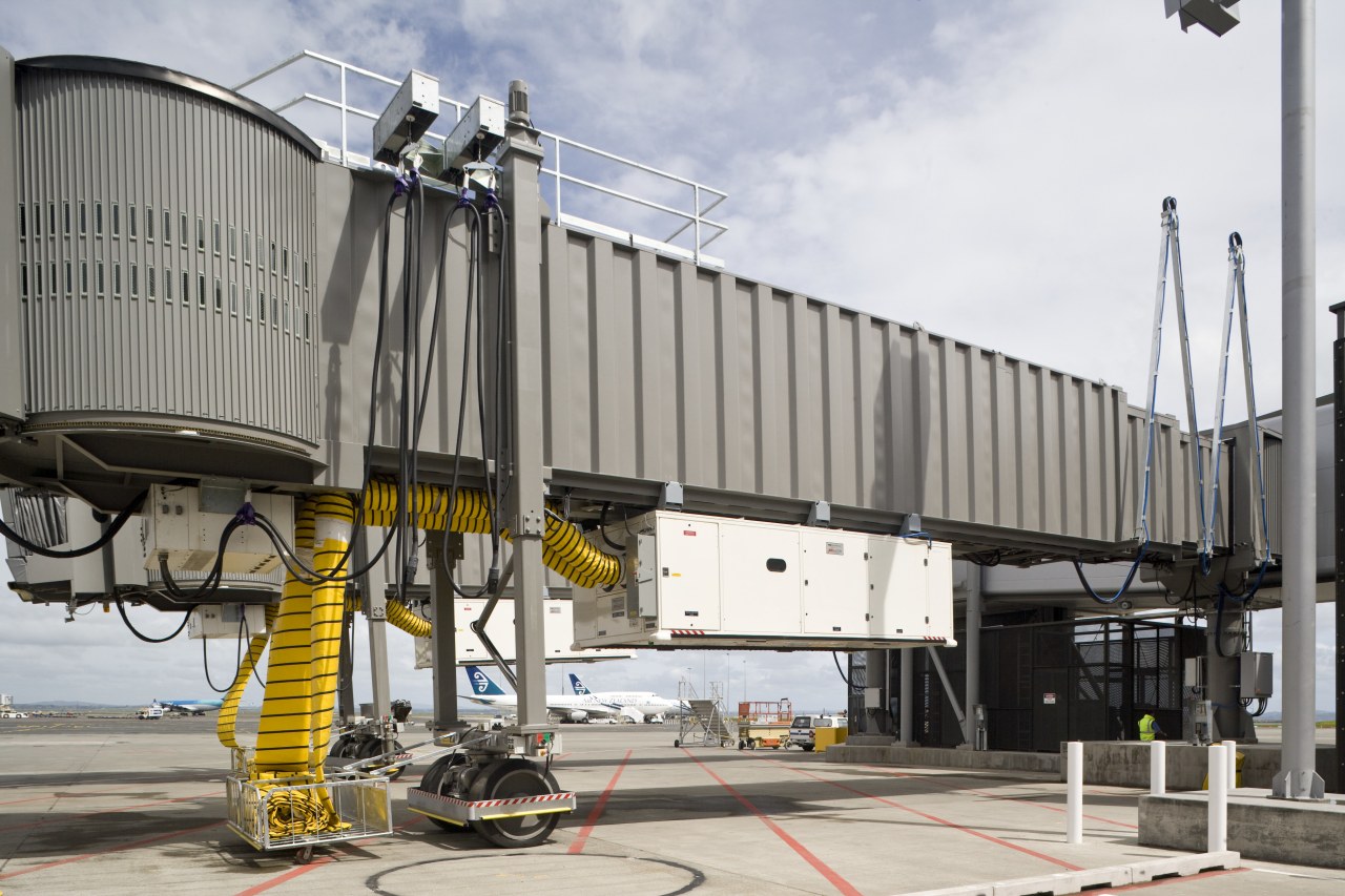 Images of the outside of Auckland International Airport jet bridge, transport, gray, white