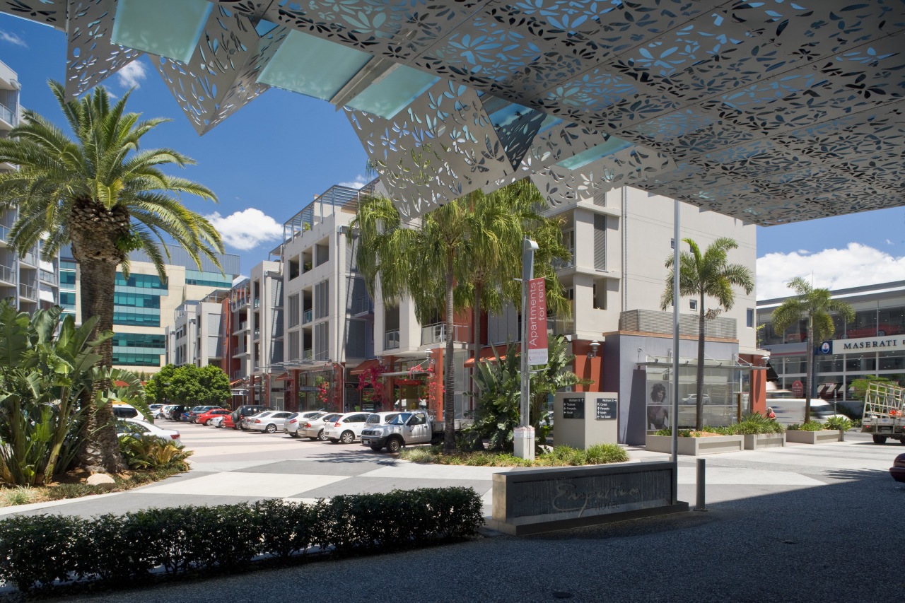 View of the Emporium precinct which is part architecture, arecales, building, city, condominium, downtown, metropolitan area, mixed use, neighbourhood, palm tree, plant, plaza, real estate, residential area, sky, tree, black