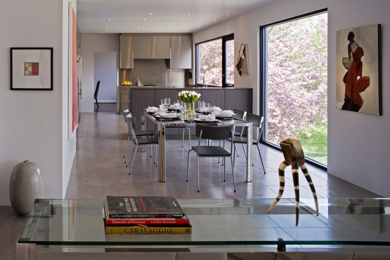 View of the open-plan kitchen and dining area dining room, floor, furniture, home, house, interior design, living room, room, table, gray