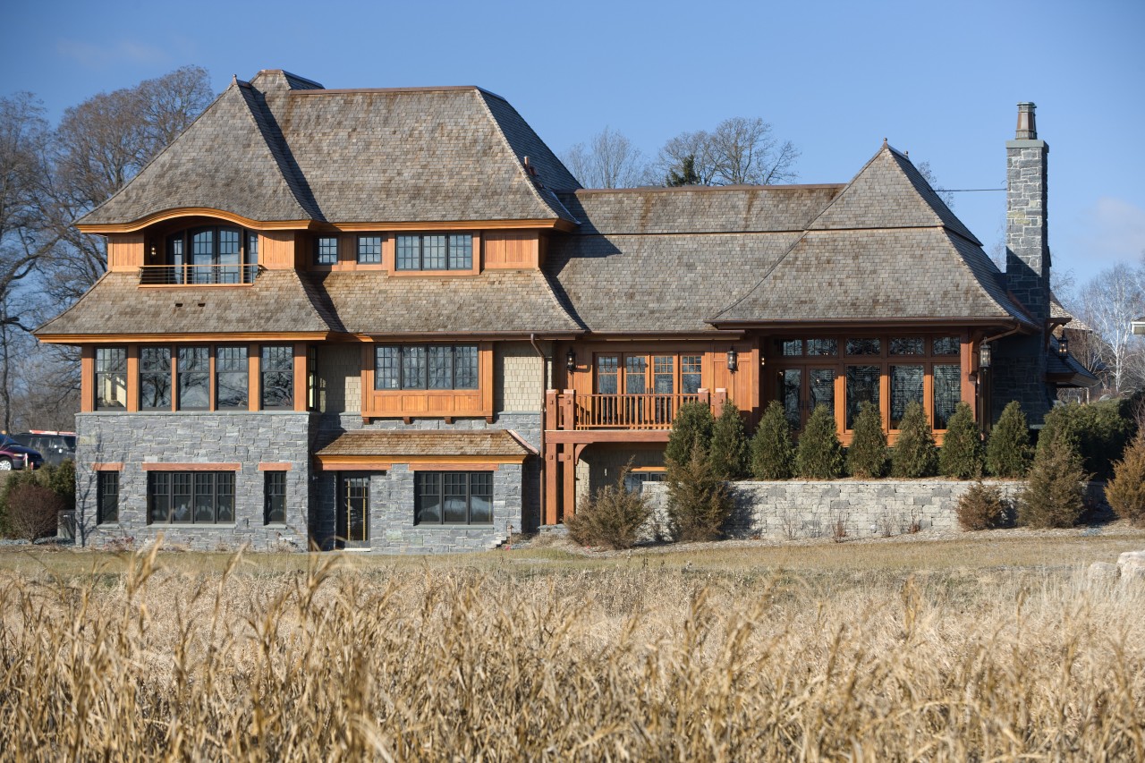 Exterior view of this home designed by Charlie building, cottage, estate, facade, farmhouse, home, house, mansion, property, real estate, roof