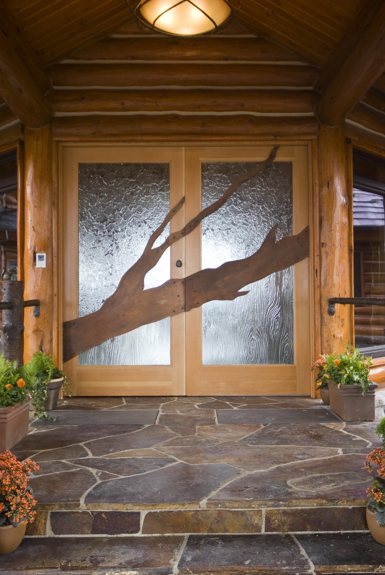 Image of unique designs on glass doors created door, floor, flooring, hardwood, home, house, interior design, outdoor structure, porch, real estate, wall, window, wood, wood stain, brown