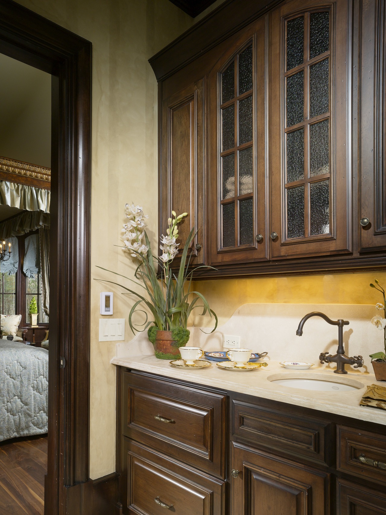 View of a wet-bar with coffee and tea cabinetry, countertop, cuisine classique, furniture, home, interior design, kitchen, room, window, brown