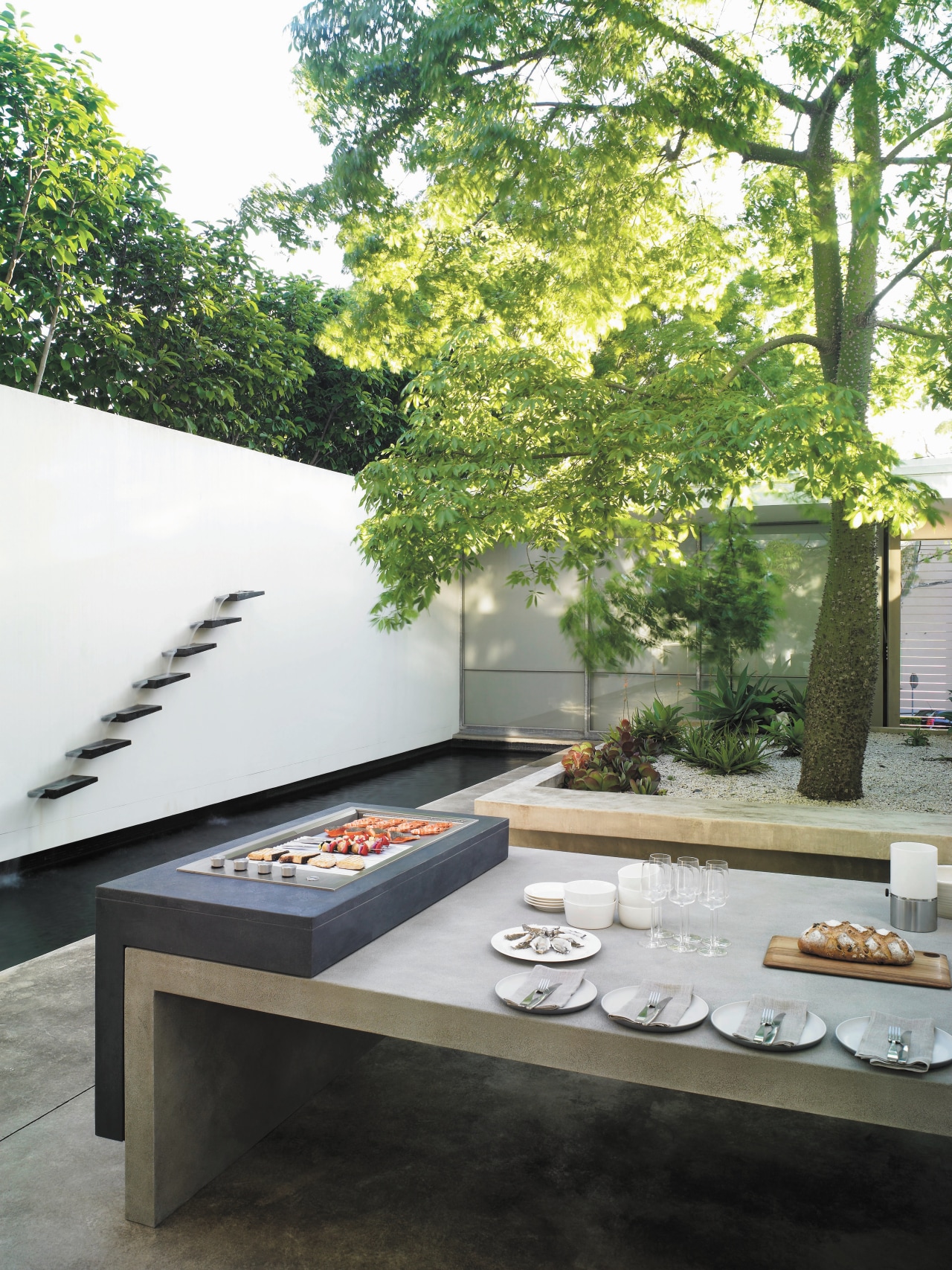 View of outdoor area which features outdoor cooking architecture, courtyard, furniture, home, house, table, white