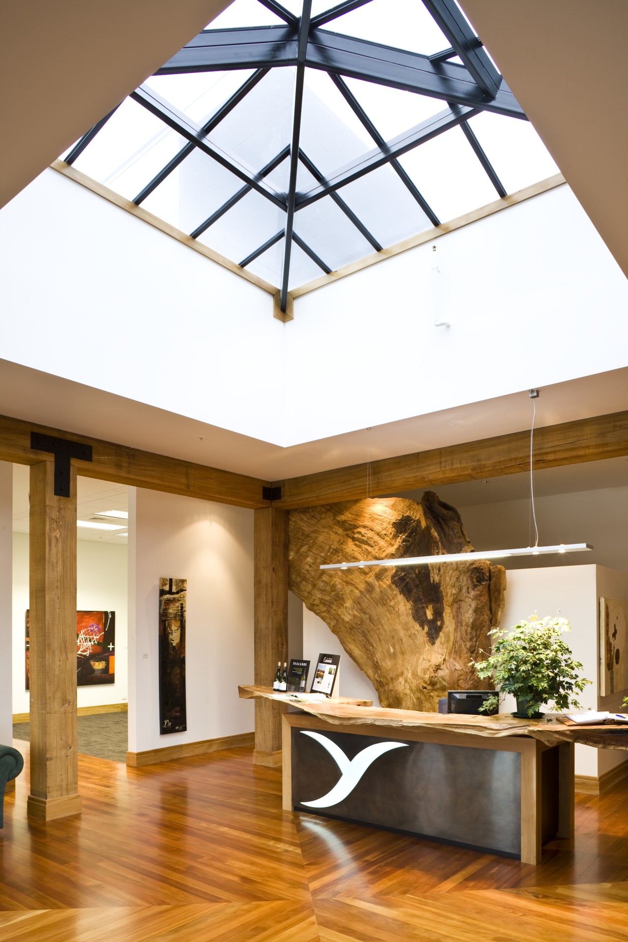 view of the reception area which features wooden ceiling, daylighting, home, interior design, light fixture, lighting, window, white, brown, orange