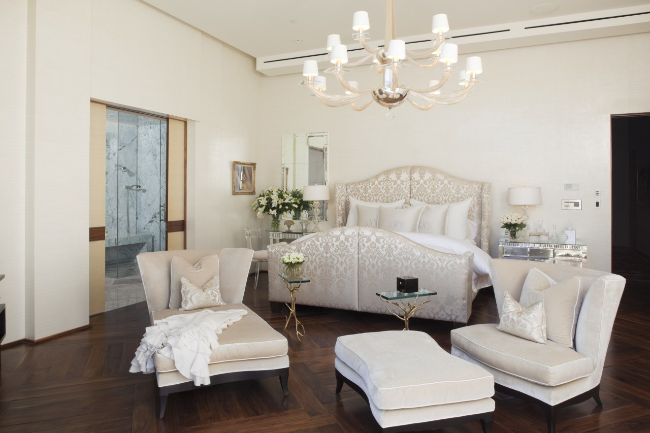 view of the master bedroom which features wooden bed frame, bedroom, ceiling, floor, furniture, home, interior design, living room, real estate, room, suite, white