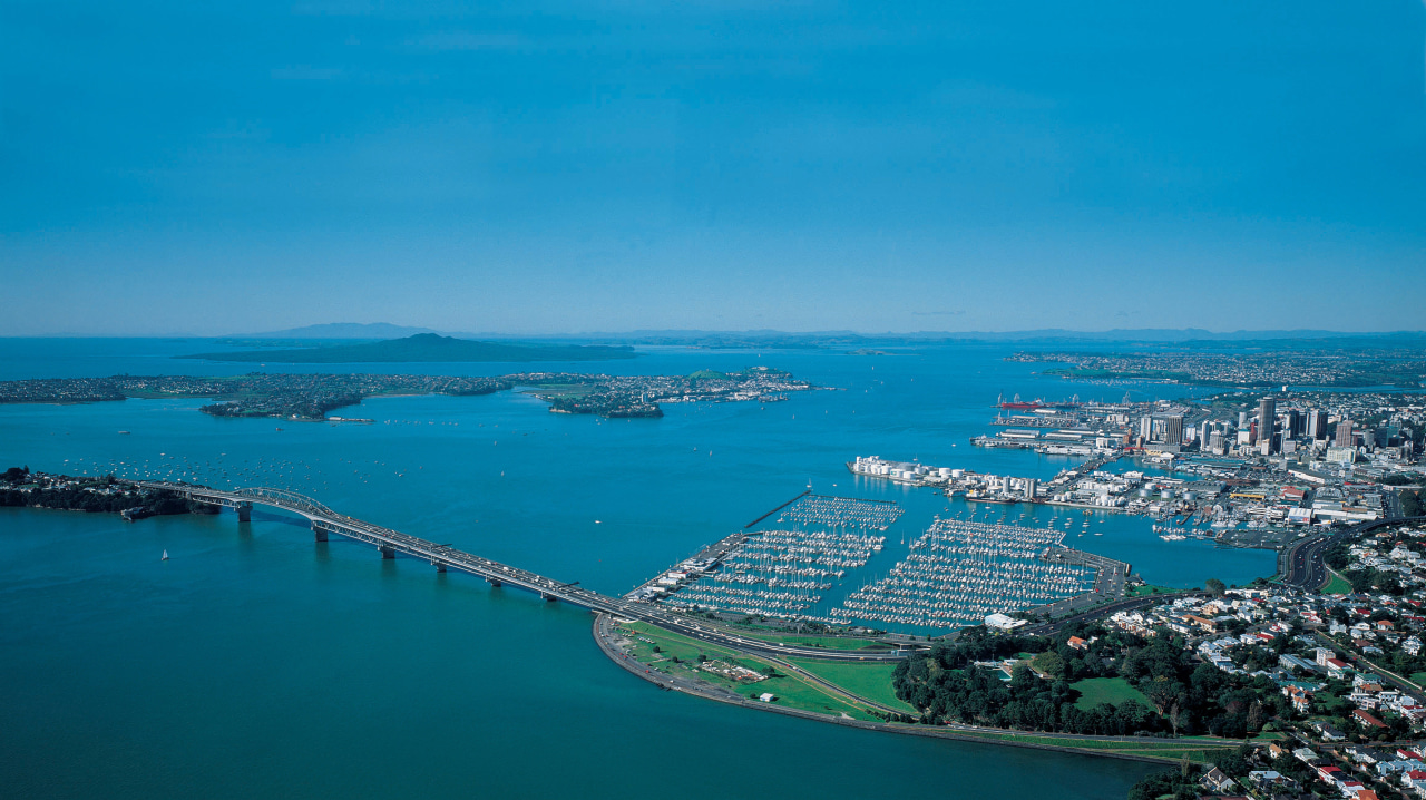Image of the beautiful Auckland City. aerial photography, artificial island, bay, bird's eye view, city, coast, coastal and oceanic landforms, fixed link, inlet, sea, sky, water, water resources, teal