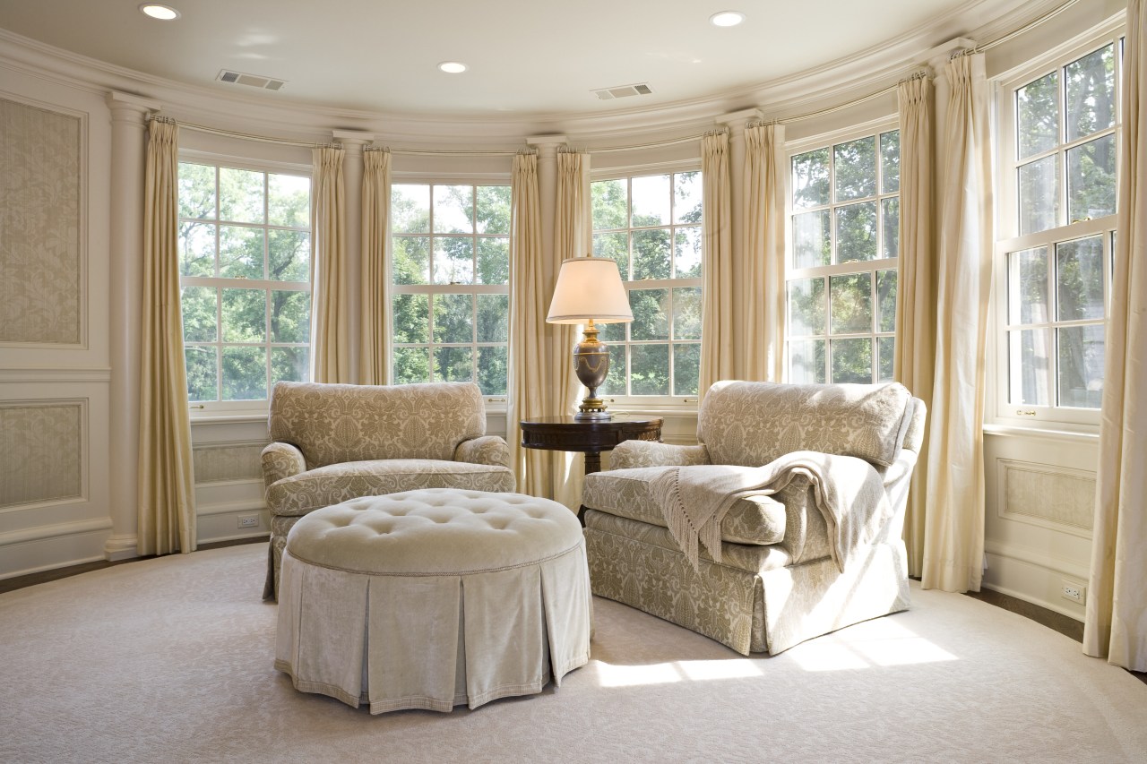 View of upholstered arm chairs, cushioned foot rest, ceiling, estate, floor, furniture, home, interior design, living room, property, real estate, room, wall, window, window treatment, gray