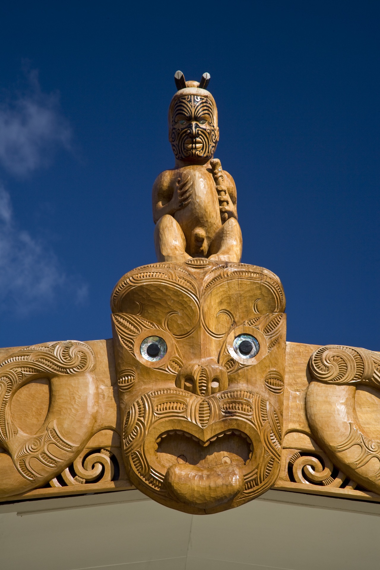 Images of Te Whanua O Tupuranga School, which ancient history, archaeological site, artifact, carving, monument, sculpture, statue, temple, tiki, blue, brown