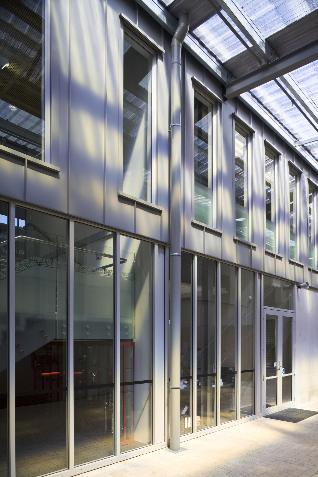 Exterior view of school which features cladding manufactured architecture, building, corporate headquarters, daylighting, facade, glass, headquarters, metropolitan area, structure, window, gray, black