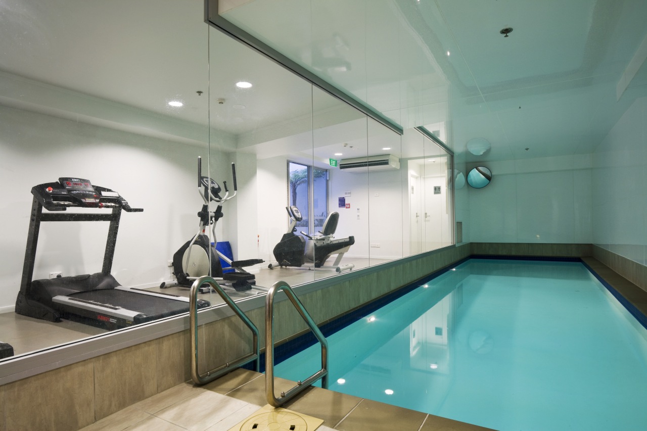 View of a pool and gym area in billiard room, interior design, leisure centre, recreation room, room, swimming pool, teal, gray