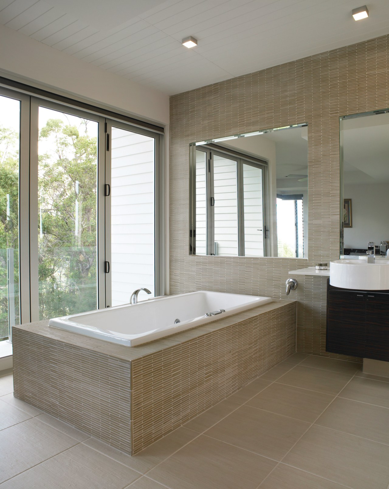 View of a bathroom which features Scyon Secura bathroom, bathtub, floor, flooring, home, interior design, room, tile, wall, window, gray