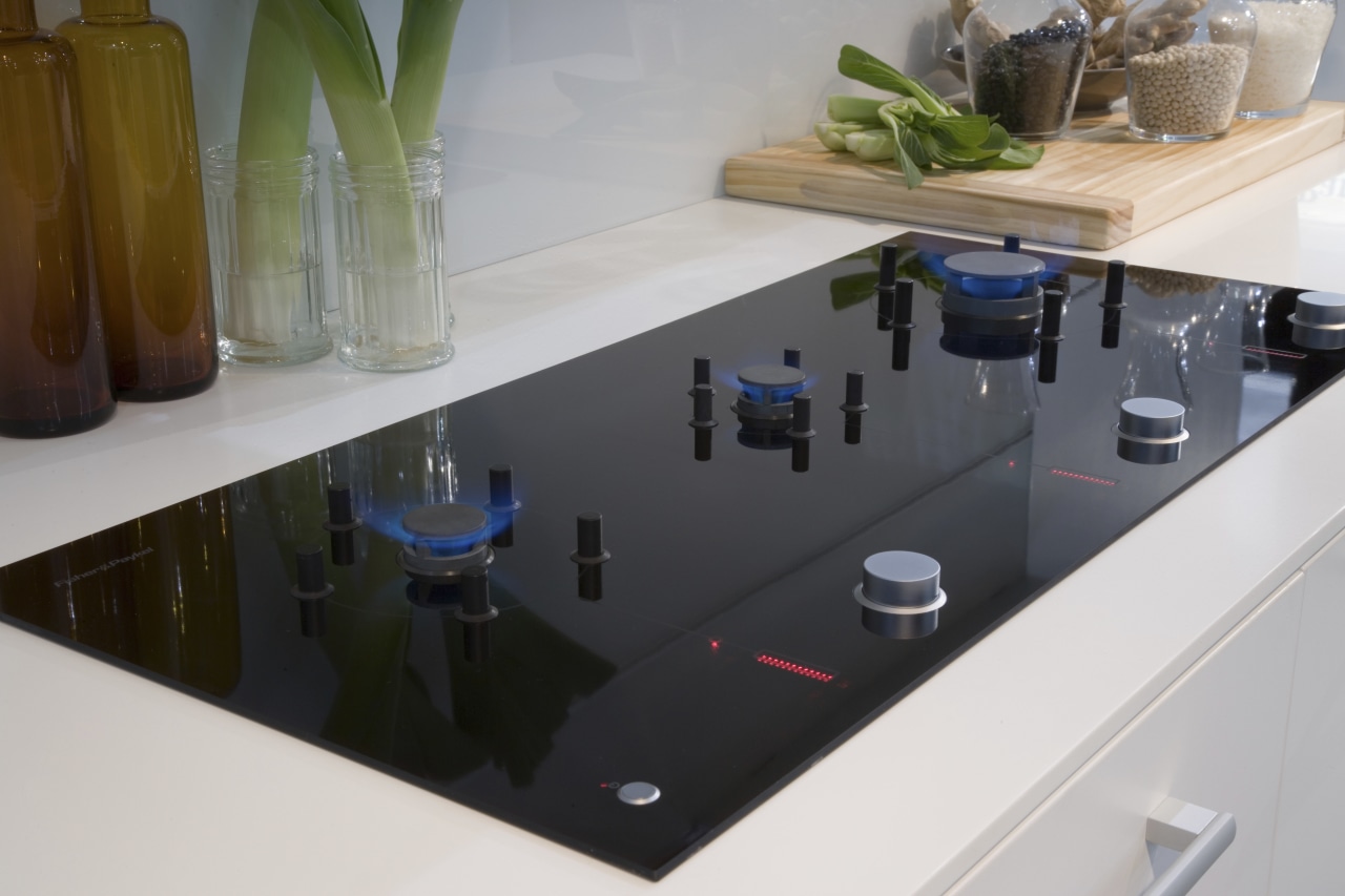 View of a kitchen which features a Fisher countertop, furniture, glass, product design, table, white, gray, black