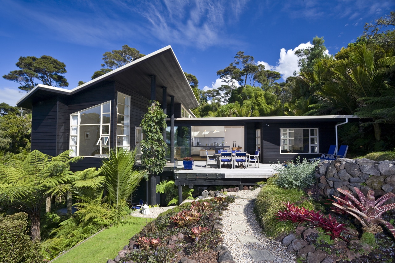 Set amid native bush on an elevated coastal architecture, cottage, elevation, estate, home, house, landscape, neighbourhood, plant, property, real estate, residential area, roof, tree, villa, yard, black