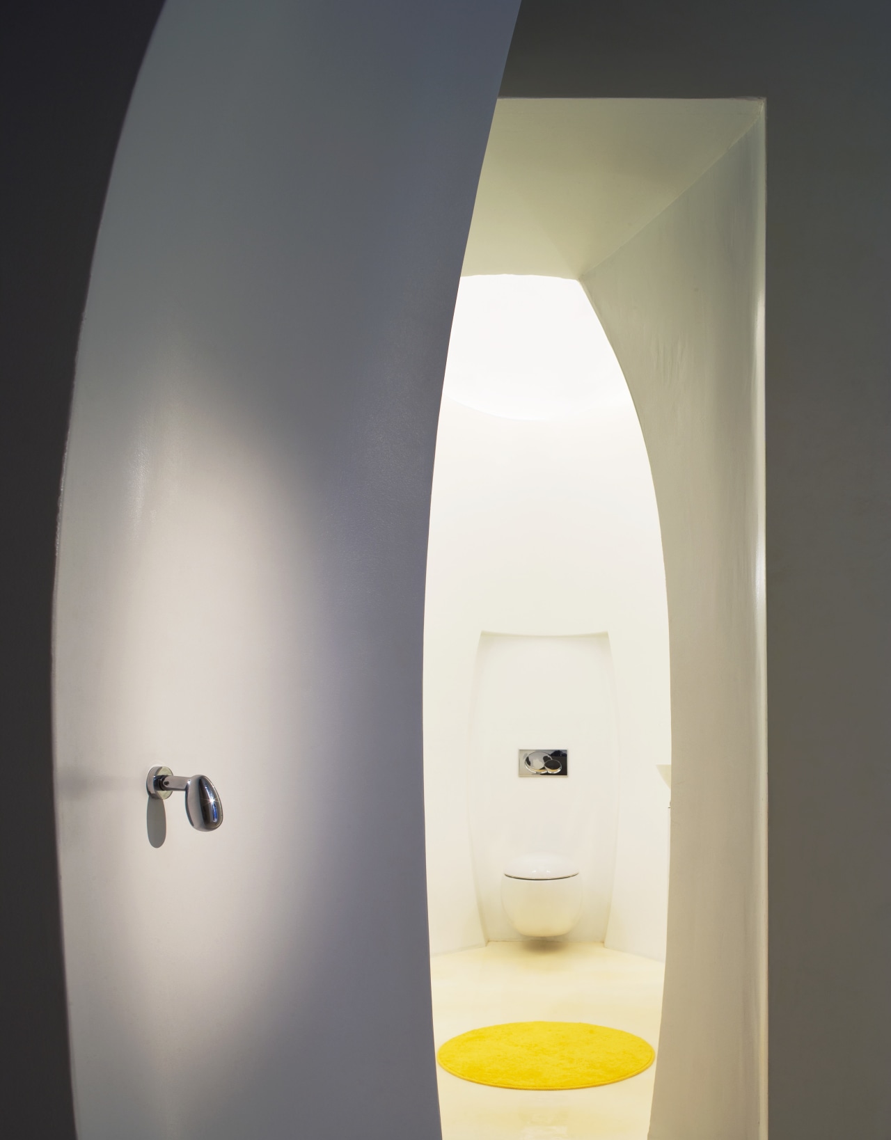 View of a powder room with an egg-shape light fixture, lighting, product design, gray, white