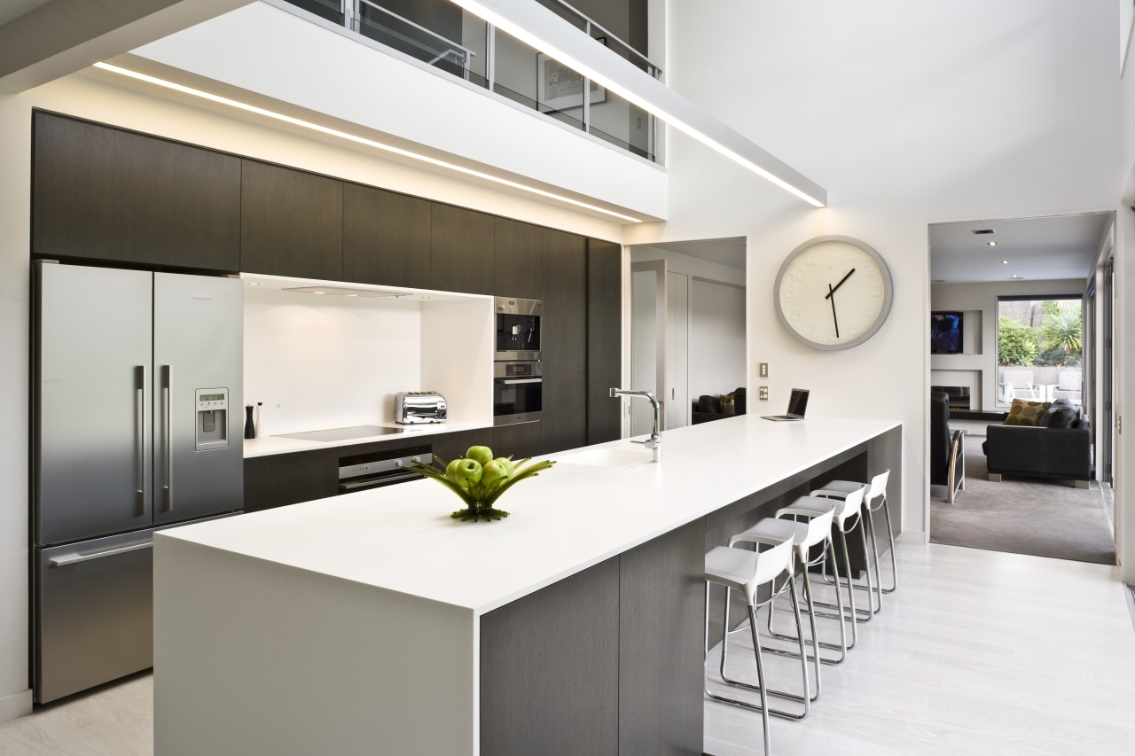 View of kitchen featuring large island, dark-stained oak countertop, interior design, kitchen, real estate, white