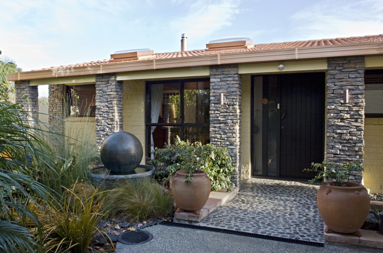 Exterior view of a renovated home which features backyard, courtyard, estate, facade, home, house, outdoor structure, property, real estate, window