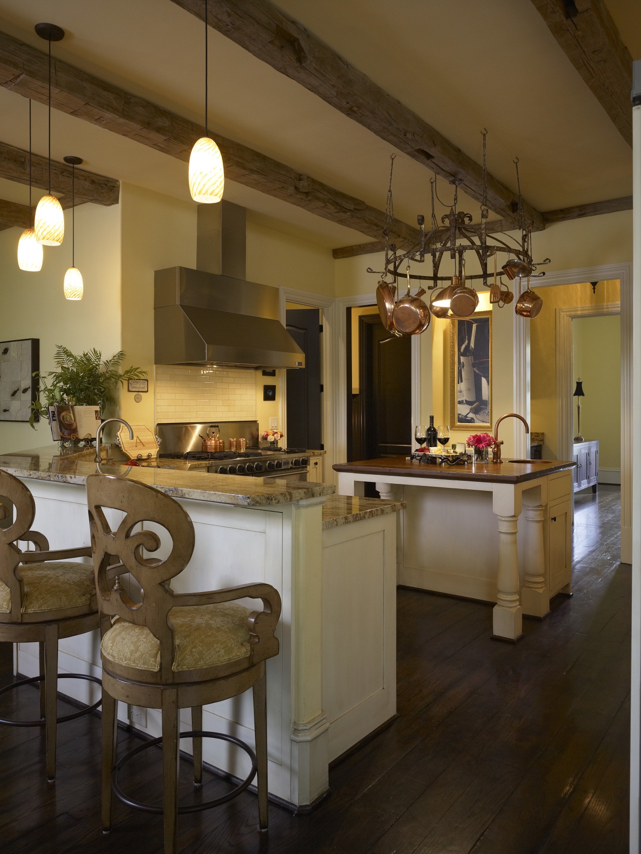 View of an open-plan kitchen featuring a central ceiling, countertop, interior design, kitchen, lighting, room, brown