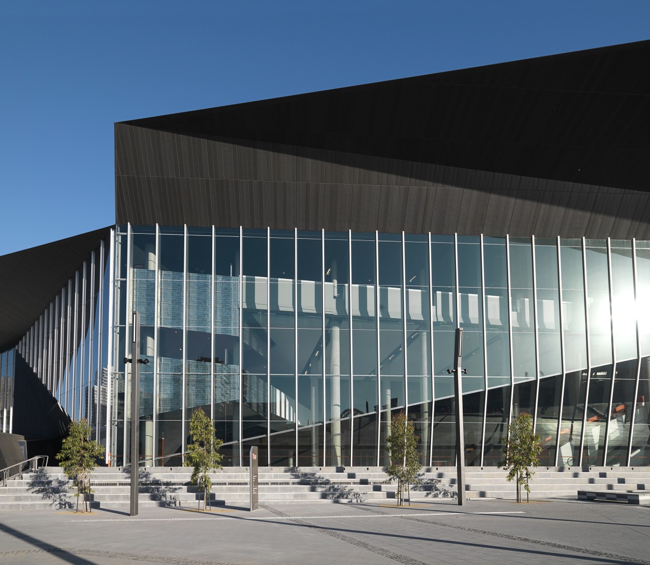 Exterior view of the Melbourne Convention Centre which architecture, building, commercial building, convention center, corporate headquarters, daylighting, daytime, facade, headquarters, metropolitan area, mixed use, reflection, sky, structure, black