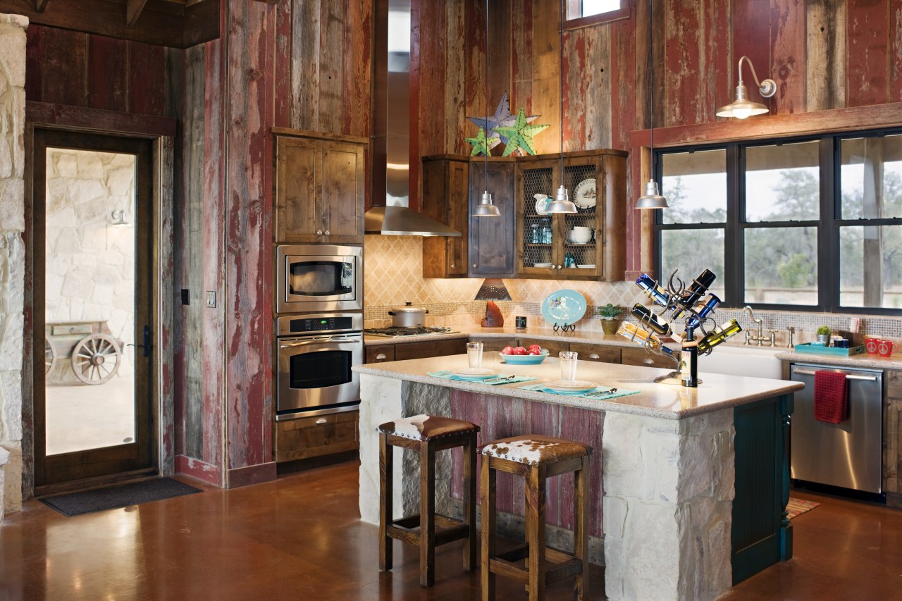 View of a farmhouse styled kitchen which features cabinetry, countertop, home, interior design, kitchen, real estate, room, table, wood, brown