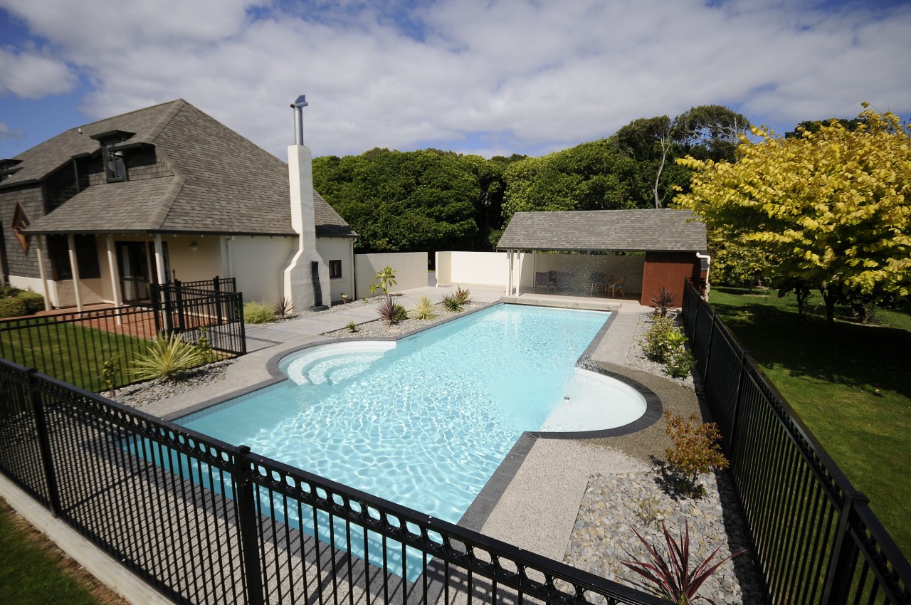 View of a pool are with a resort cottage, estate, home, house, leisure, property, real estate, resort, swimming pool, villa, water, gray