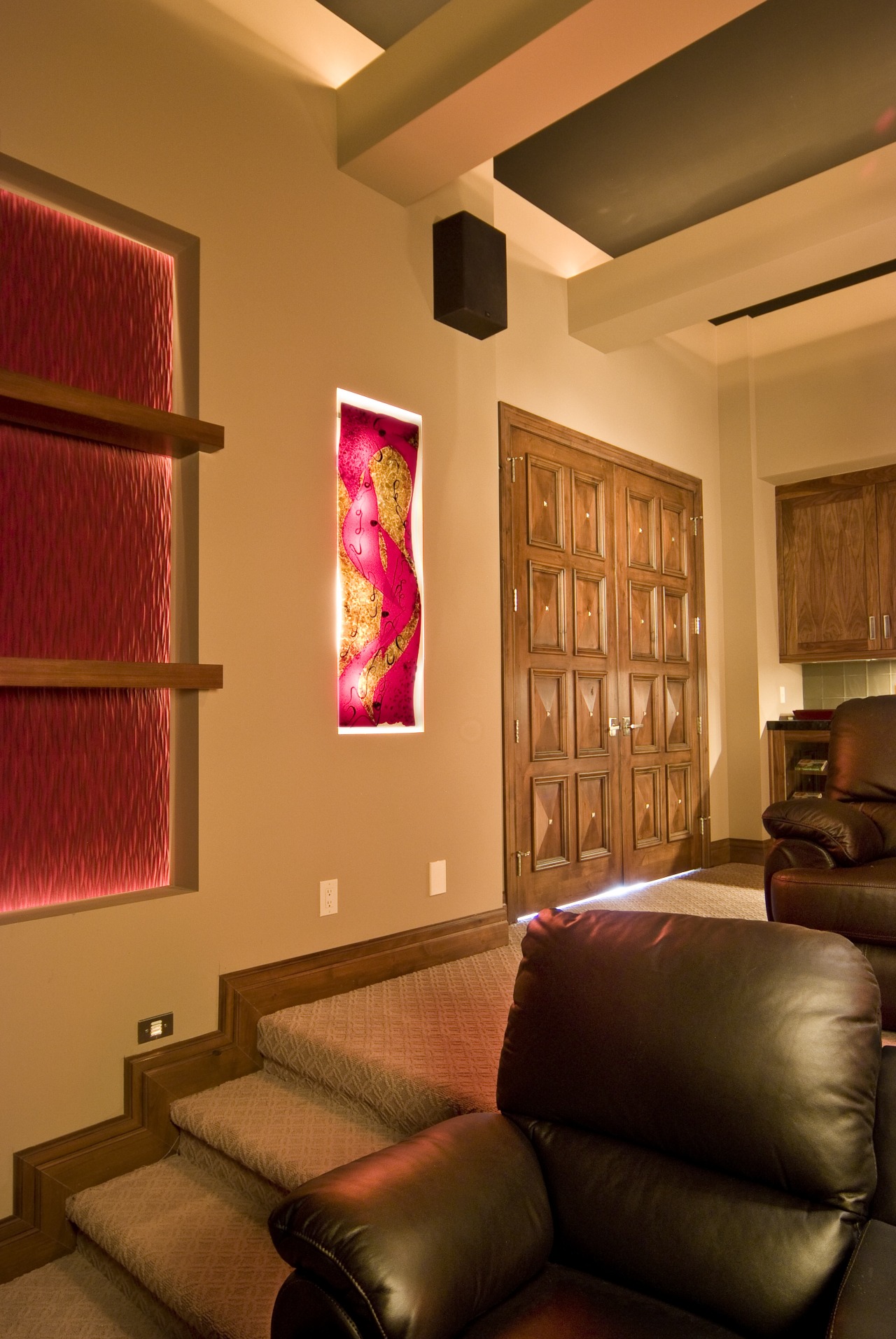 View of the home theatre which features slumped ceiling, home, interior design, lighting, living room, room, wall, orange, brown