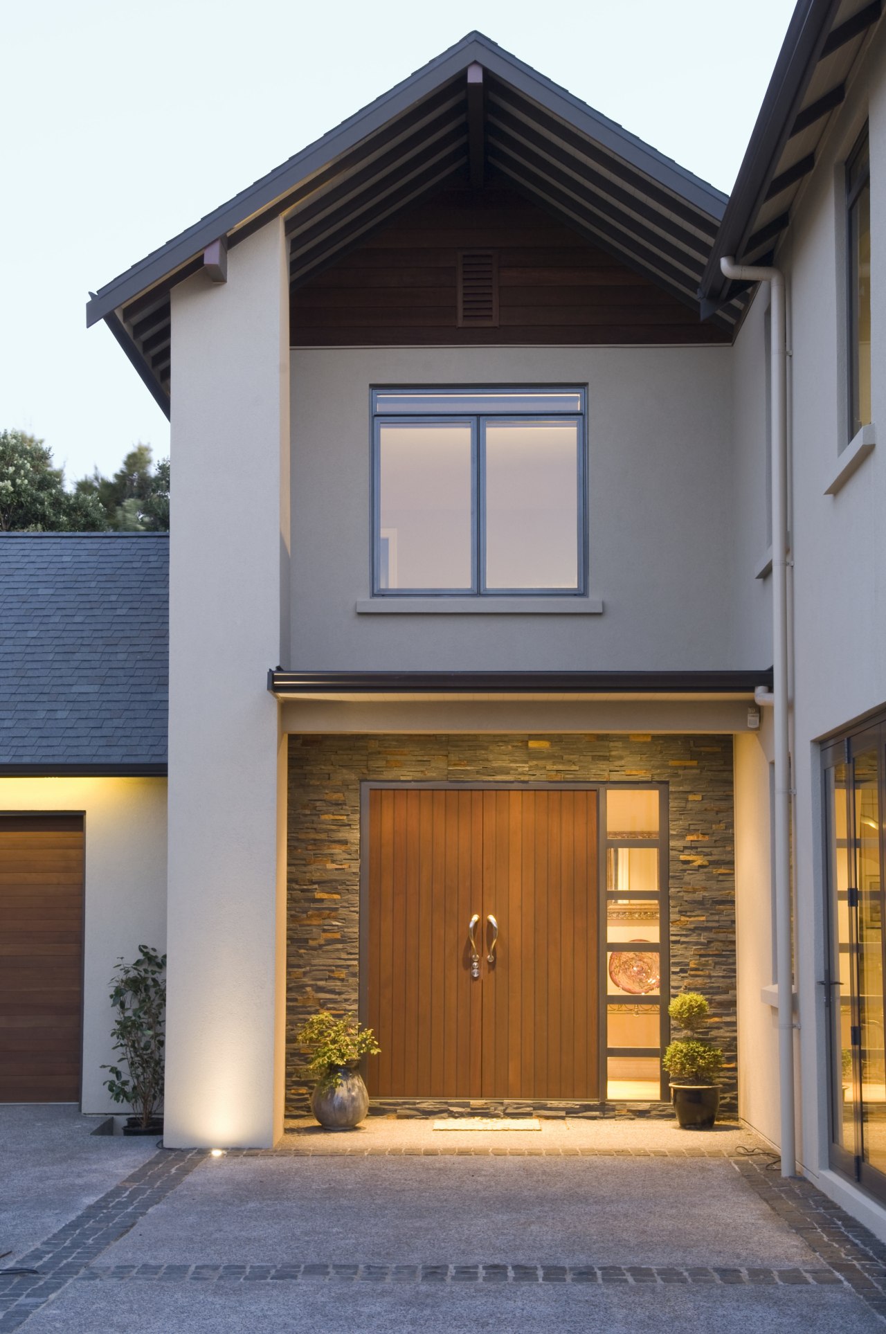 Exterior view of a home built by Walmsley building, door, facade, garage, garage door, home, house, property, real estate, siding, window, gray