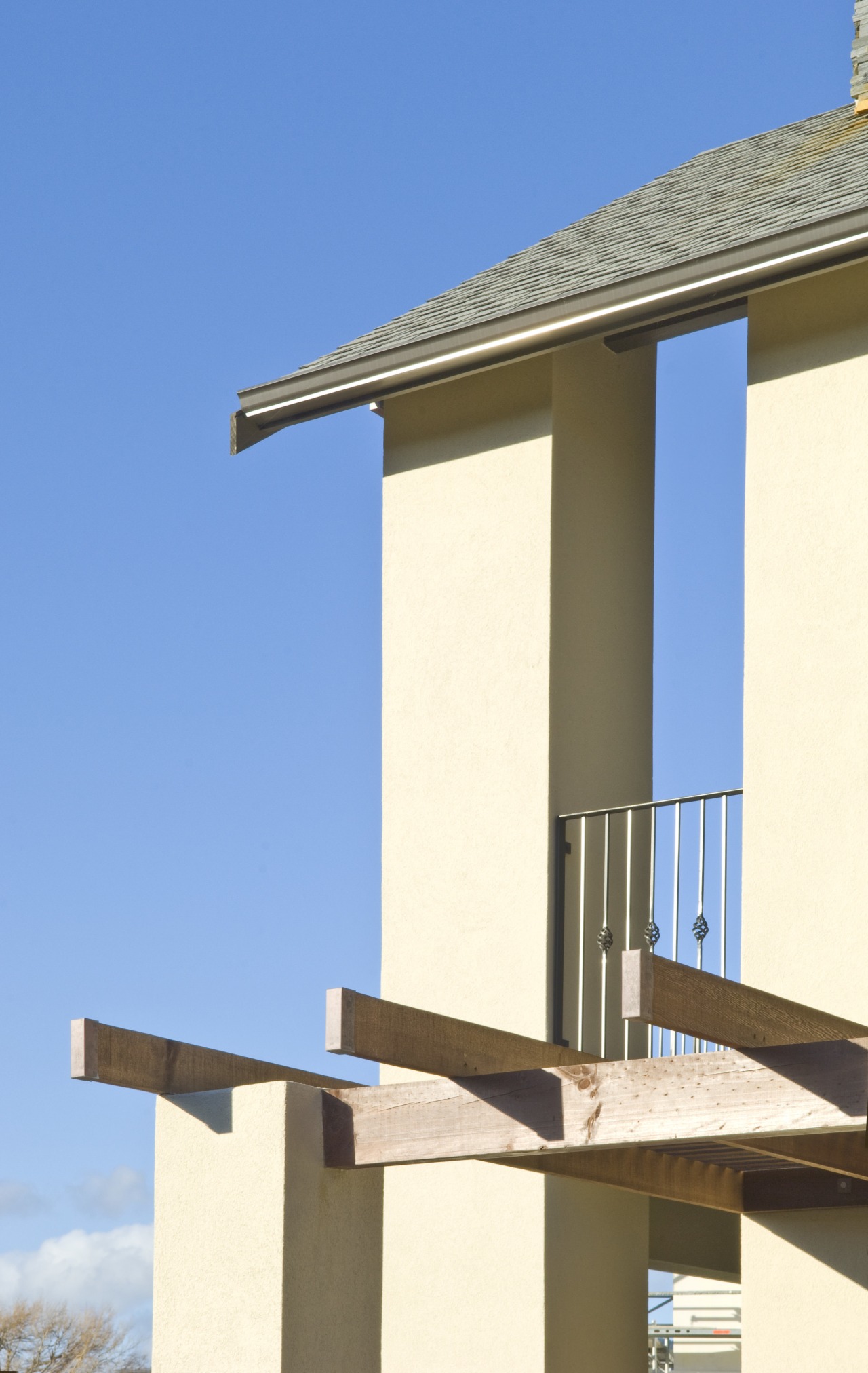 Exterior view of a high-end home with a architecture, building, column, facade, house, sky, structure, window, teal