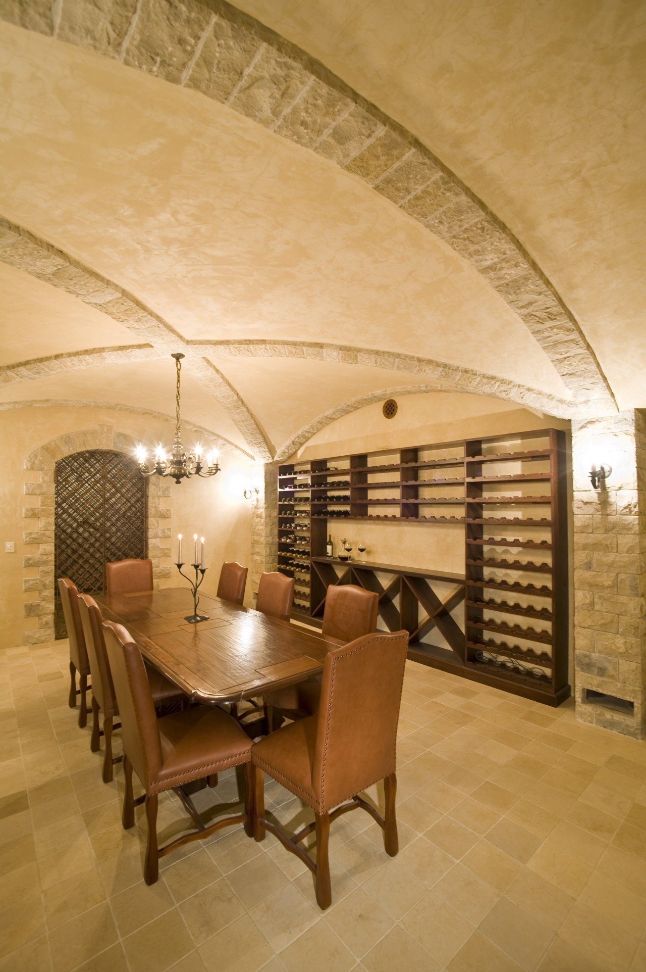 View of a wine cellar which features limestone architecture, ceiling, estate, floor, flooring, interior design, room, wall, wine cellar, orange, brown