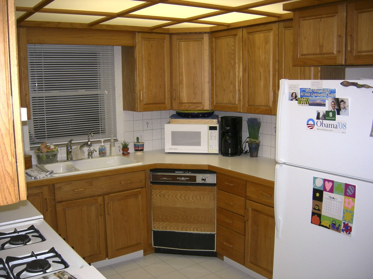 View of the kitchen prior to renovations. cabinetry, countertop, kitchen, room, brown