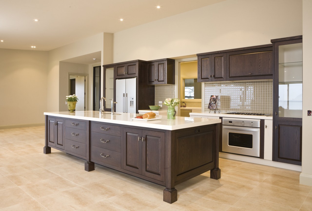 View of a kitchen which designed by a cabinetry, countertop, cuisine classique, floor, flooring, hardwood, interior design, kitchen, real estate, room, wood flooring, orange