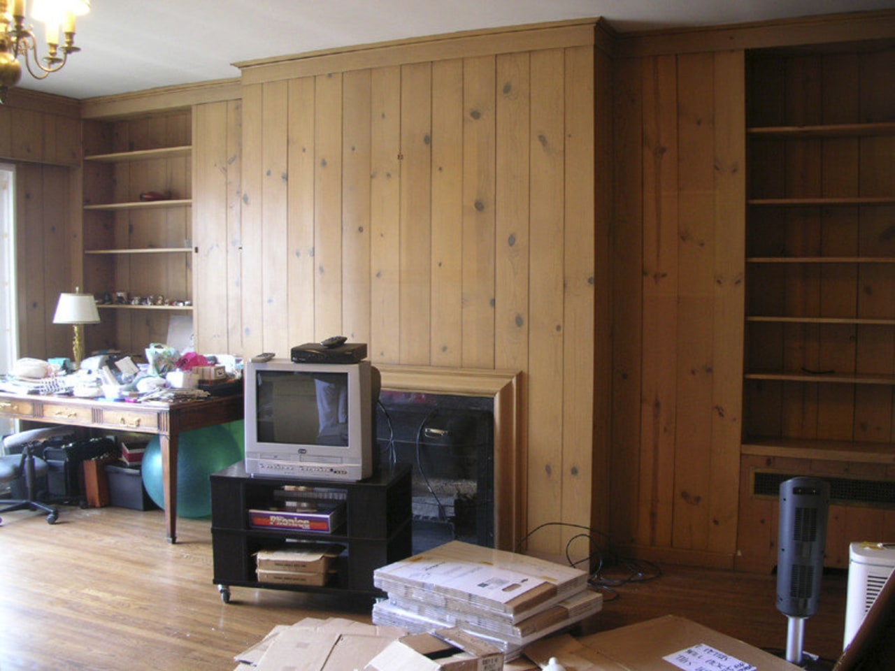 Before shots of a San Francisco TownHouse. cabinetry, floor, flooring, furniture, hardwood, interior design, living room, room, shelving, wall, wood, wood stain, brown