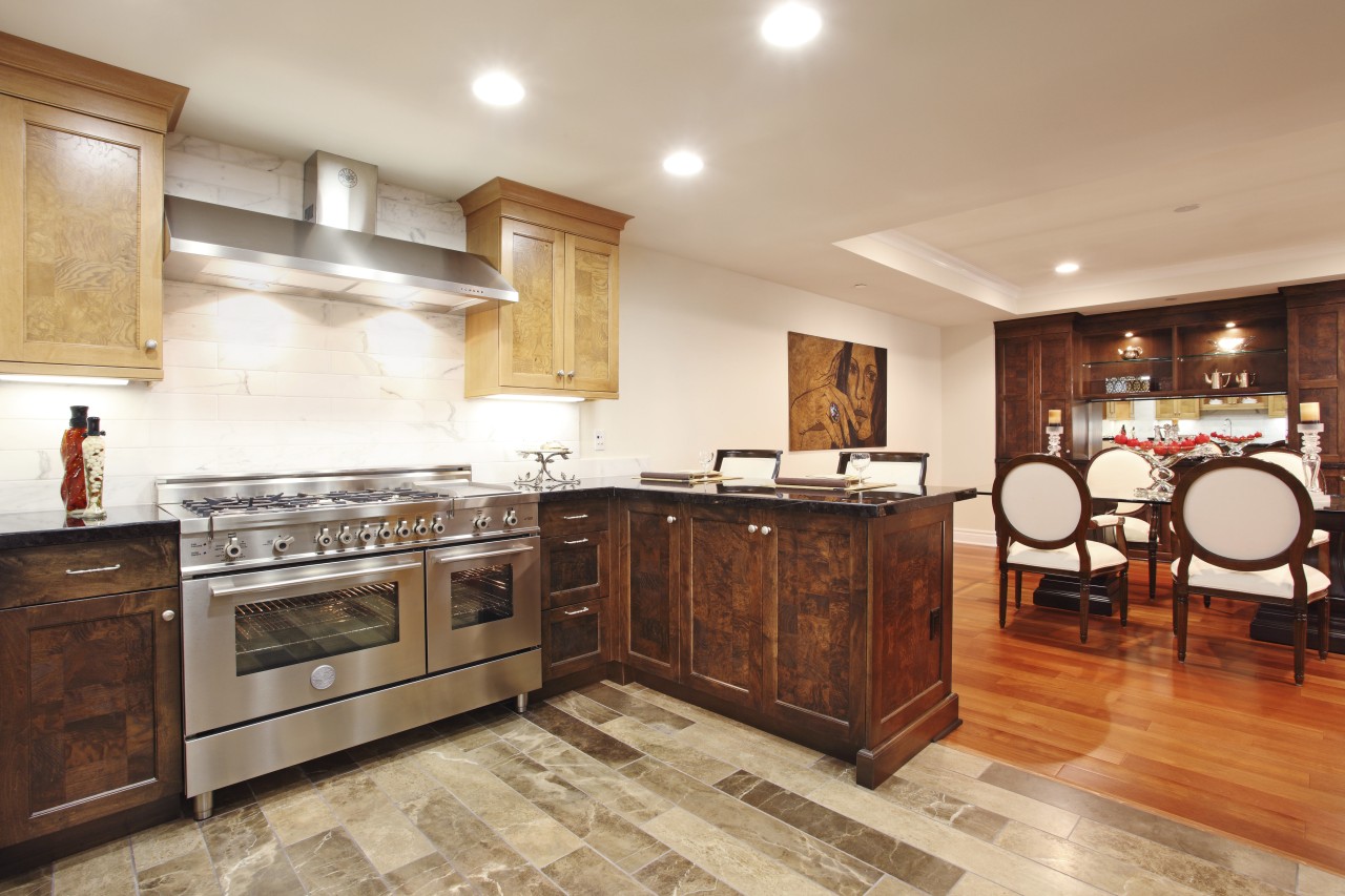 View of a contemporary kitchen which features a cabinetry, countertop, cuisine classique, estate, floor, flooring, hardwood, interior design, kitchen, property, real estate, room, wood flooring, orange, white