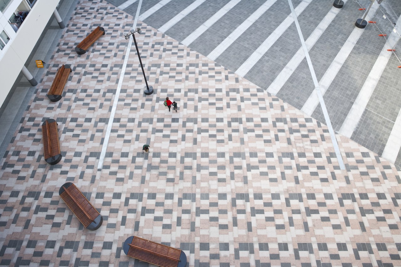 External view of kings square development. Tiling supplied floor, flooring, line, road surface, roof, sidewalk, structure, gray, white