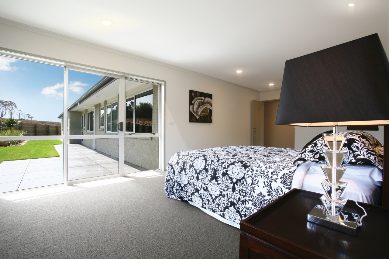 View of master bedroom of this Platinum Homes architecture, bedroom, ceiling, estate, home, house, interior design, property, real estate, room, suite, window, gray, white